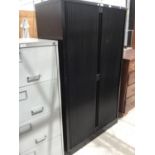 A BLACK OFFICE FILING CABINET WITH ROLLER DOORS