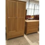 A MODERN LIGHT WARDROBE AND CHEST OF THREE DRAWERS
