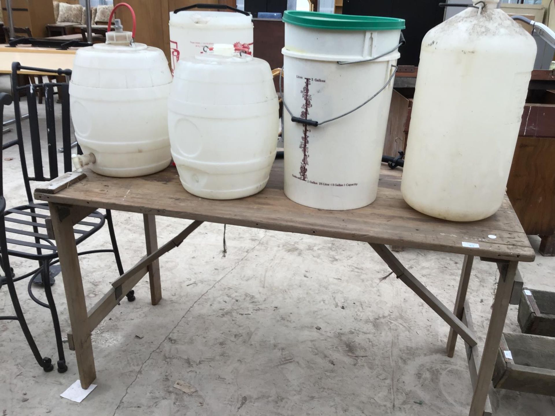 A VINTAGE WOODEN TRESTLE TABLE WITH VARIOUS PLASTIC BREWING BUCKETS AND BARRELS - Image 2 of 2