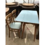 A RETRO FORMICA KITCHEN TABLE WITH TWO CHAIRS