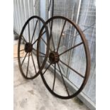 A PAIR OF LARGE METAL VINTAGE WHEELS