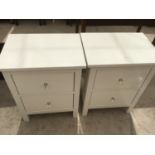 A PAIR OF MODERN WHITE BEDSIDE TABLES