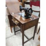 A VINTAGE OAK SEWING TABLE MACHINE WITH SINGER SEWING MACHINE