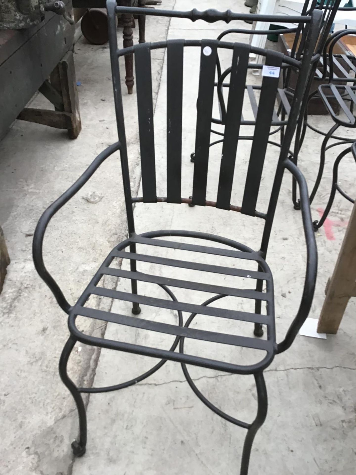 FIVE METAL GARDEN ARM CHAIRS