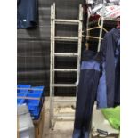 A FOURTEEN RUNG TWO SECTION ALUMINIUM STEP LADDER