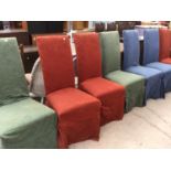 A SET OF SIX DINING CHAIRS WITH COLOURED COVERS