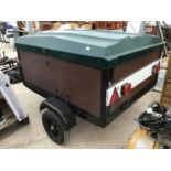 A 4.5FT X 4.5FT TRAILER IN EXCELLENT CONDITION WITH FIBREGLASS COVER, TRAILER BOARD AND FRONT TOOL