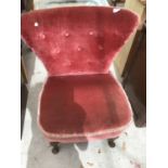 A PINK UPHOLSTERED BEDROOM CHAIR