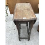 AN OAK DROP LEAF TABLE