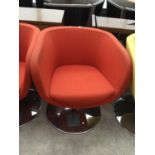 A RETRO RED FABRIC SWIVEL TUB CHAIR IN CIRCULAR CHROME SUPPORT