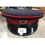 A BRITISH ARMY PEAKED CAP WITH BADGE