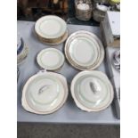 A DINNER SERVICE TO INCLUDE, PLATES, SIDE PLATS, SERVING DISHES ETC