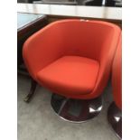 A RETRO RED FABRIC SWIVEL TUB CHAIR IN CIRCULAR CHROME SUPPORT