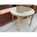 A BAMBOO AND GLASS TOPPED CONSERVATORY TABLE