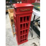 A RED WOODEN TELEPHONE STORAGE BOX