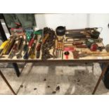 A LARGE COLLECTION OF TOOLS TO INCLUDE SAWS, HAMMERS, CHISELS, CHAINS, PLANES ETC