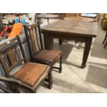 AN OAK DRAW LEAF TABLE WITH TWO DINING CHAIRS