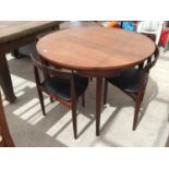 A DANISH RETRO TEAK FREM ROJLE DINING TABLE AND FOUR CHAIRS