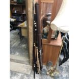 A VINTAGE THREE PIECE FISHING ROD