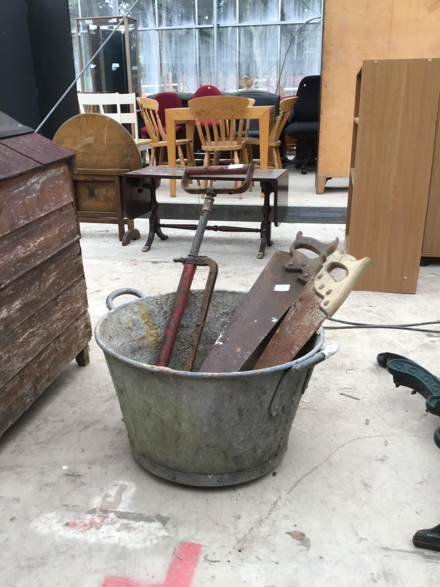 A GALVANISED TUB WITH A BARREL PUMP AND TWO SAWS - Image 2 of 2