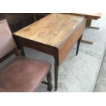 A MAHOGANY DROP LEAF DINING TABLE