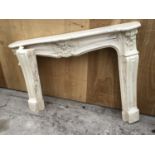 A DECORATIVE MARBLE EFFECT FIRE PLACE SURROUND