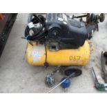 A WOLF AIR COMPRESSOR WITH TWO COMPRESSOR TOOL ATTACHMENTS