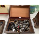 A WOODEN BOX WITH LOCK AND KEY, WITH A LARGE COLLECTION OF VARIOUS WRIST WATCHES