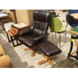 A BROWN LEATHERETTE ARMCHAIR AND FOOTSTOOL