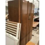 AN OAK TWIN DOOR WARDROBE