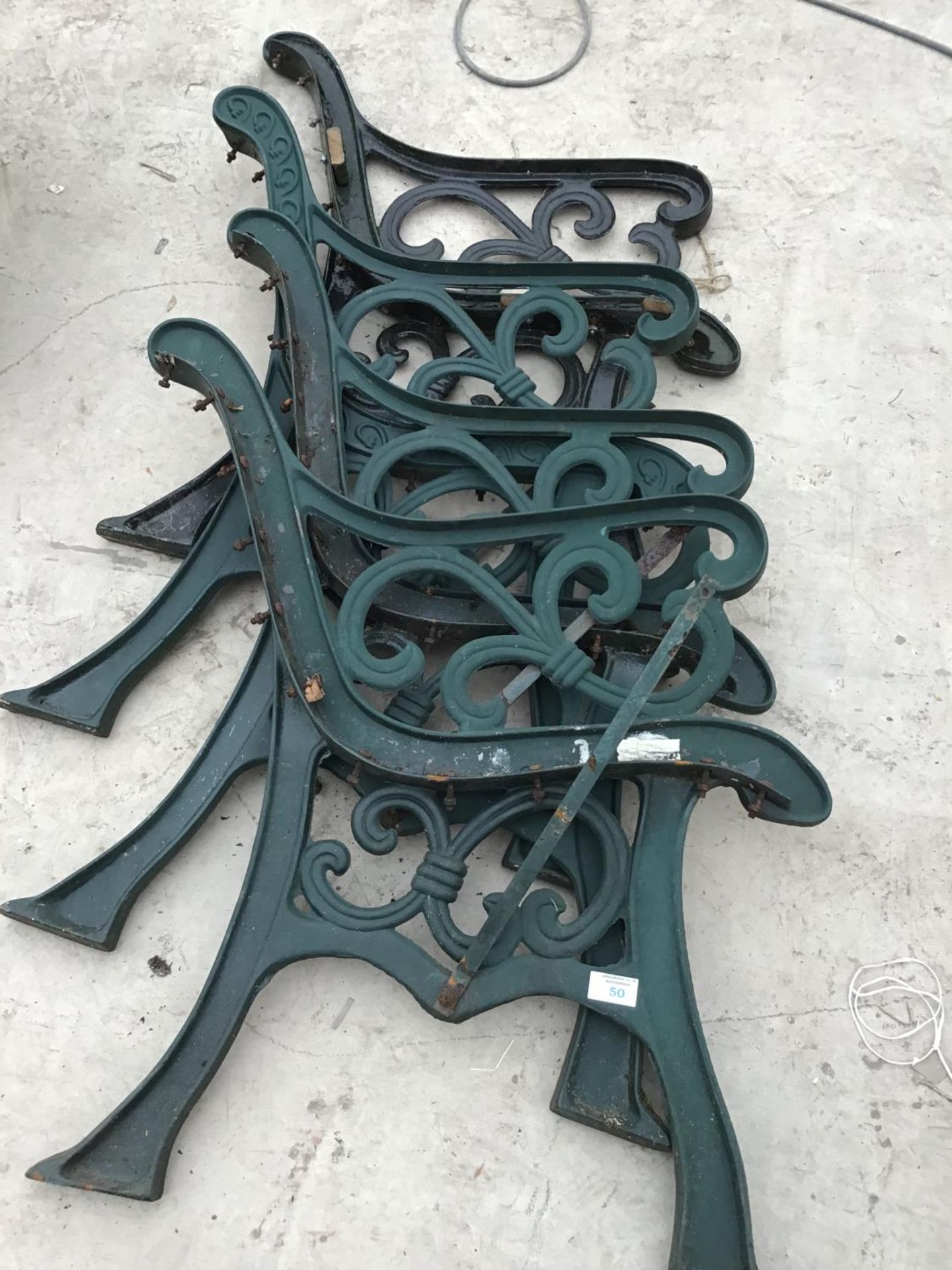 TWO PAIRS OF CAST IRON BENCH ENDS