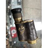 A VINTAGE OFFICERS MONOCULAR WIT CROWS FOOT