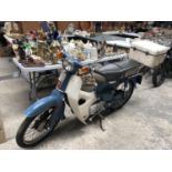 A 1976 HONDA C70 MOTORCYCLE WITH V5