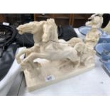 A RESIN MODEL OF A HORSE AND CHARIOT