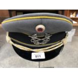 A REPRODUCTION GERMAN OFFICERS CAP WITH BADGE
