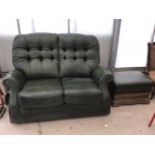 A GREEN LEATHER BUTTO BACK TWO SEATER WITH FOOTSTOOL