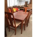 AN ORIENTAL STYLE HARDWOOD DINING TABLE WITH MATCHING SIX DINING CHAIRS