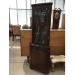 A MAHOGANY CORNER DISPLAY CABINET