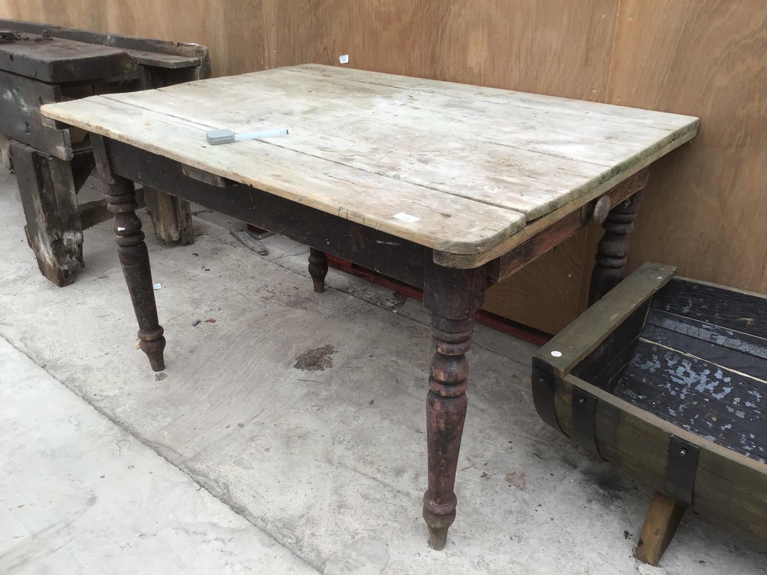 A VINTAGE PINE FARMHOUSE STYLE TABLE WITH DRAWER