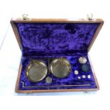 A CASED GOLD WEIGHING SCALES KIT