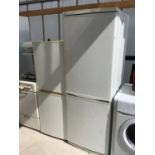 A DAEWOO FRIDGE FREEZER IN WORKING ORDER (WITH WOODEN SHELVES AND ONE FREEZER DRAWER MISSING)