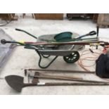 A HEAVY DUTY WHEEL BARROW AND VARIOUS GARDEN TOOLS TO INCLUDE AN AXE, HOES, FORK, WEEDER ETC