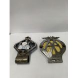 TWO VINTAGE CAR BADGES