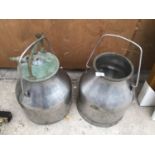 A PAIR OF VINTAGE STAINLESS STEEL MILKING CHURNS