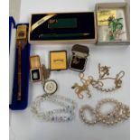 A LARGE COLLECTION OF ITEMS TO INCLUDE RINGS, NECKLACES, PENS ETC