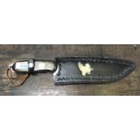 A HANDCRAFTED HUNTING STYLE KNIFE