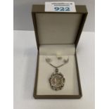 A BOXED NECKLACE WITH 6 PENCE COIN PENDANT