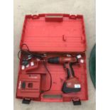 A HILTI SF180A CORDLESS DRILL IN A CASE WITH BATTERY AND CHARGER IN WORKING ORDER