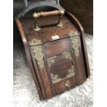 A VINTAGE MAHOGANY COAL SCUTTLE WITH BRASS BANDING