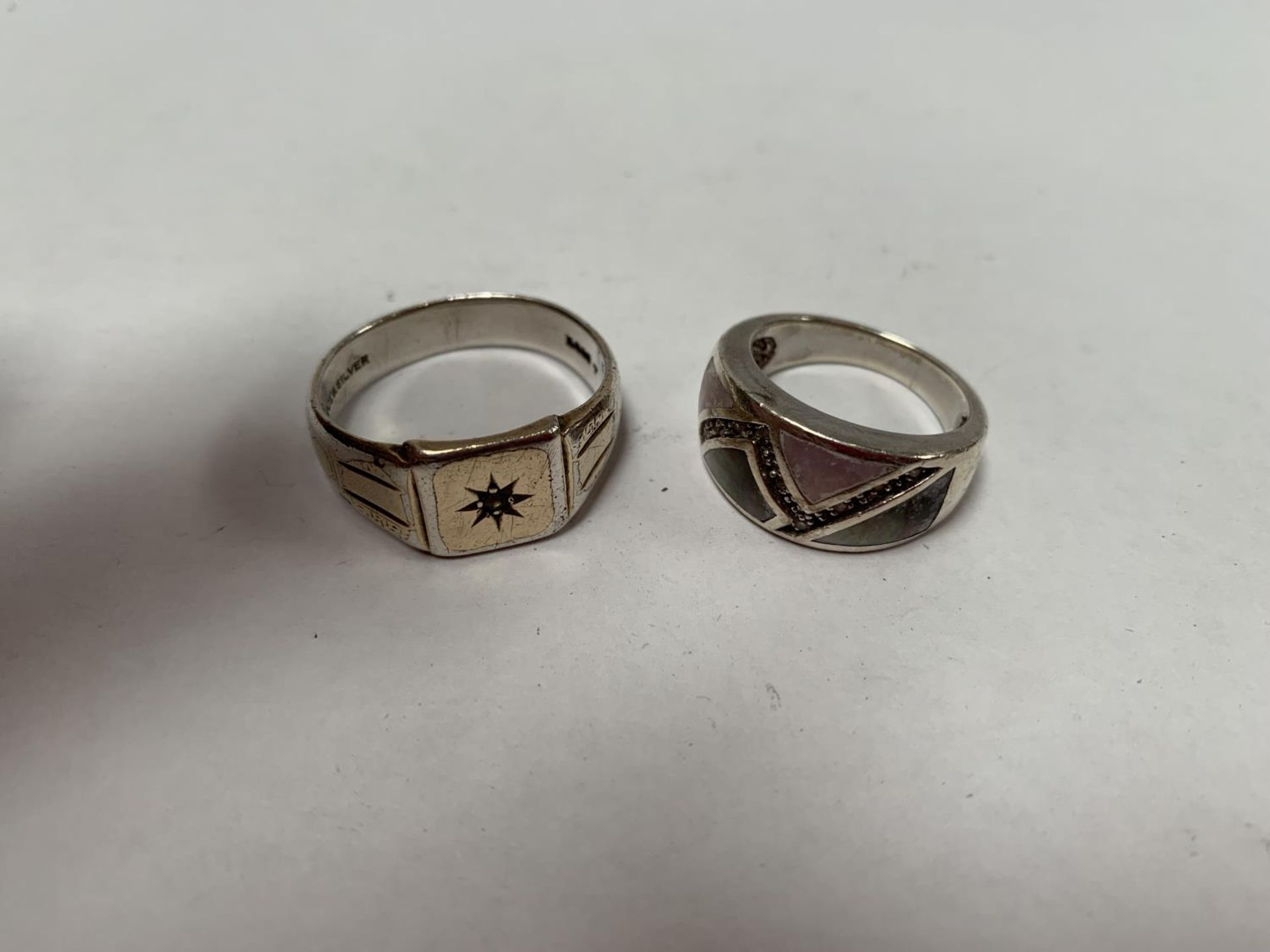 TWO SILVER RINGS , ONE GILT SILVER